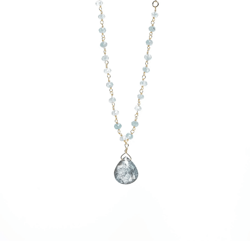 Delicate necklace featuring light blue beads and a teardrop-shaped pendant with a textured surface, designed as the Alice Rosary Necklace | Liv & B.