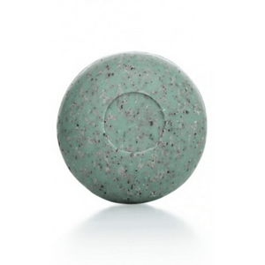 Round green speckled bar of Seaweed Soap | Phytomer on a white background, designed for skincare and body care use.