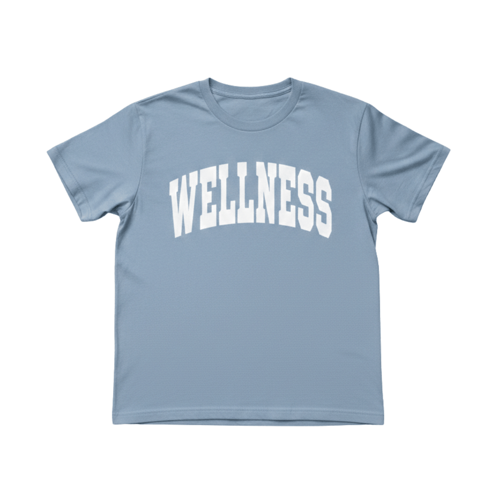 Light blue crew neck t-shirt with "WELLNESS" printed in white varsity-style letters across the chest, Wellness Varsity T-Shirt | Lucky Owl.
