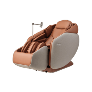 Ceragem Pause M10 - Brown | Ceragem full-body massage chair in brown with cushioned armrests, leg massage compartments, and built-in adjustable reading light for wellness and relaxation.