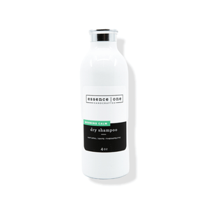 White bottle of Dry Shampoo | Essence One with a silver cap and clean, minimalist label design highlighting a natural and safe product for hair care.