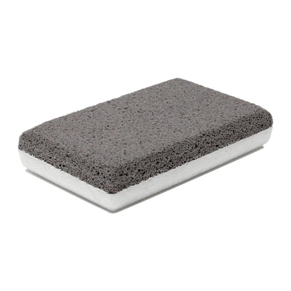 Rectangular dual-texture pumice stone with a gray exfoliating surface and white base, designed for skincare and body care use, named In The Buff Dual-Texture Siliglass Pumice Stone | Barefoot Scientist.