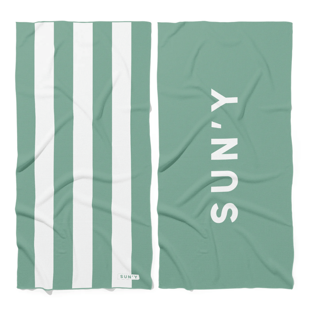 Waffle Microfiber Beach Towel - Sea Green | SUN'Y featuring white vertical stripes on one side and the SUN'Y logo in white on a solid sea green background on the other side.