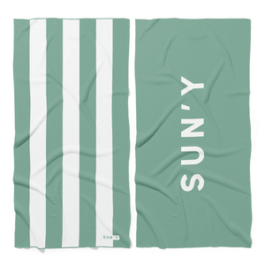 Waffle Microfiber Beach Towel - Sea Green | SUN'Y featuring white vertical stripes on one side and the SUN'Y logo in white on a solid sea green background on the other side.