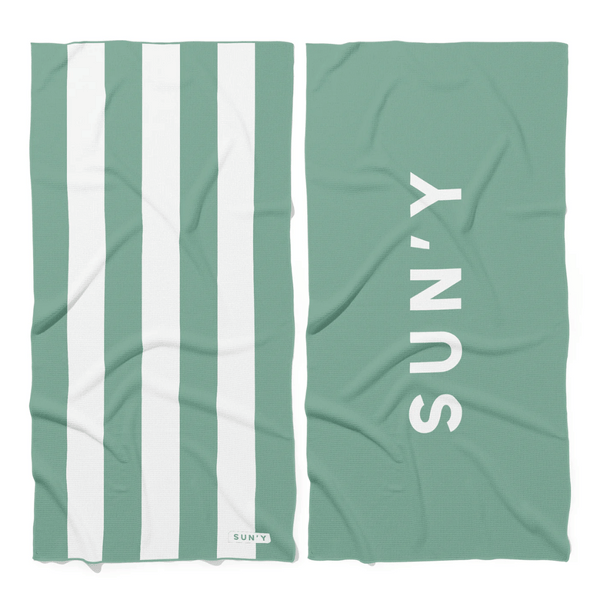 Waffle Microfiber Beach Towel - Sea Green | SUN'Y featuring white vertical stripes on one side and the SUN'Y logo in white on a solid sea green background on the other side.