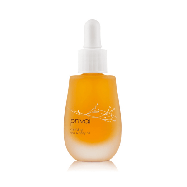 Bottle of Clarifying Face & Body Oil | Privai with golden yellow liquid and white dropper cap, designed for skincare and body care wellness.