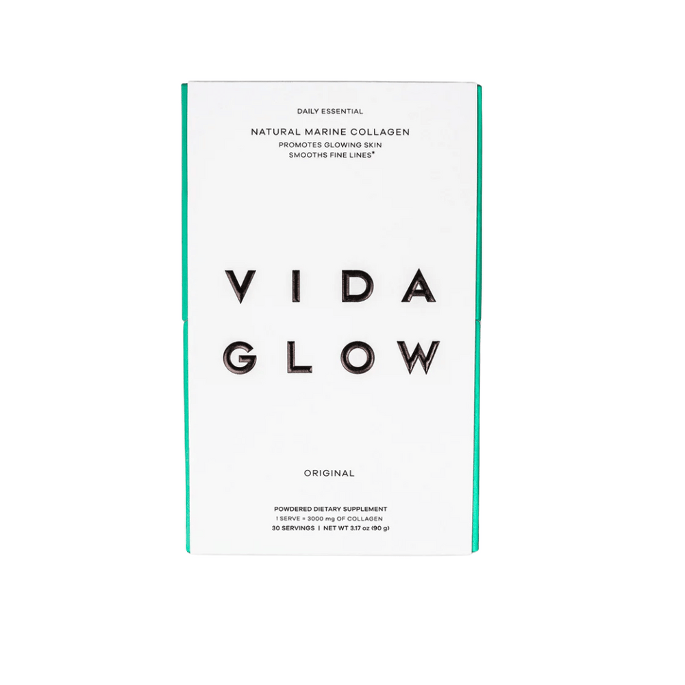White and teal packaging of Natural Marine Collagen | VIDA GLOW, a powdered dietary supplement promoting glowing skin and smoothing fine lines for skincare and wellness.