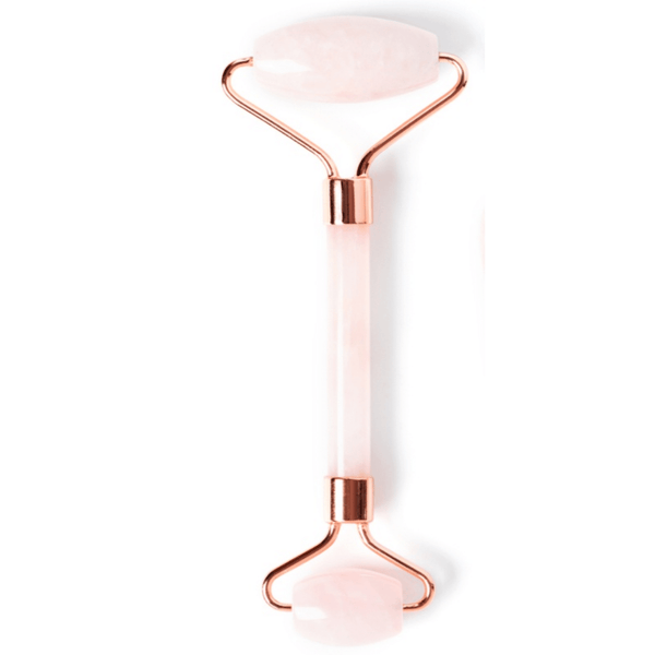 Rose Quartz Facial Roller | Privai featuring smooth rose quartz stones on both ends with rose gold metal accents, designed for facial skincare and wellness rituals.