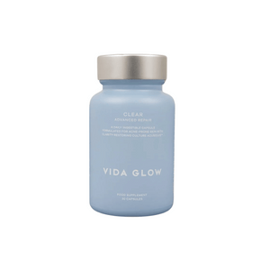 Bottle of Clear Capsules | VIDA GLOW in light blue packaging with silver cap, designed as a skincare wellness supplement for advanced repair and clarity.
