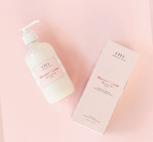Bottle and packaging of Whoopie® Cream Shea Butter | Farmhouse Fresh skincare product on pale pink background for body care and wellness.