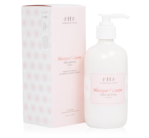 A pump bottle of Whoopie® Cream Shea Butter | Farmhouse Fresh with a matching pink box featuring skincare branding and organic heirloom cucumber extract for body care.