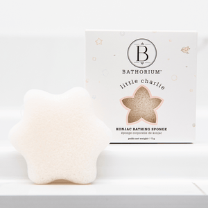 little charlie™ Konjac Sponge | Bathorium in a star shape displayed next to its white packaging, designed for gentle skincare and body care routines.