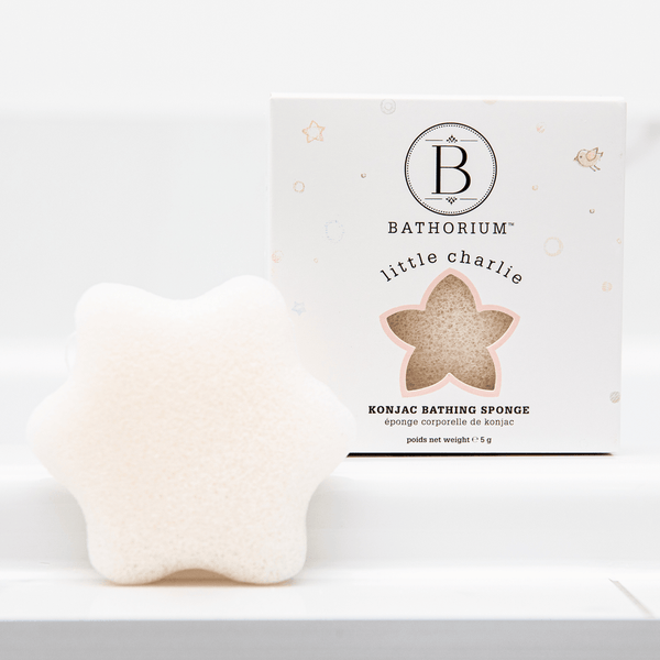little charlie™ Konjac Sponge | Bathorium in a star shape displayed next to its white packaging, designed for gentle skincare and body care routines.