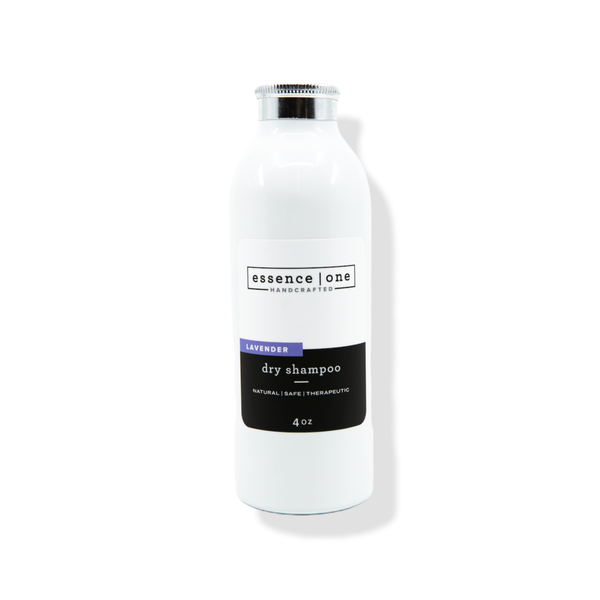 White bottle of Dry Shampoo | Essence One in lavender scent with minimalist label design showcasing natural and therapeutic qualities for hair care.