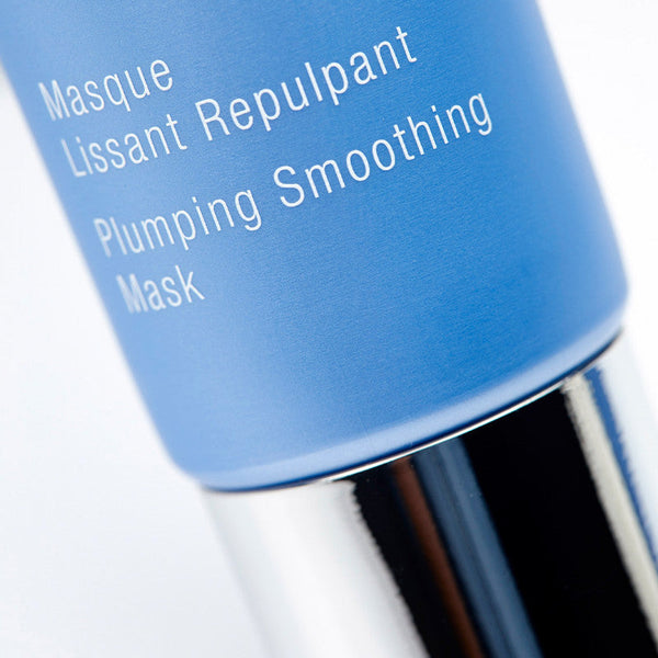 Close-up of a blue skincare tube labeled Expert Youth Mask | Phytomer featuring a plumping smoothing mask for skincare and wellness care.
