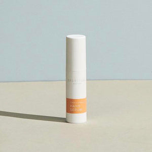 Minimalist white bottle of Citrus Cardamom HAND SERUM | Sparitual with soft natural lighting, ideal for skincare and body care wellness routines.
