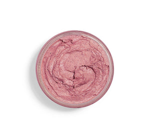 Top view of a jar containing a creamy pink skincare product, Illumination Fruit Professional Strength Brightening Fruit Acid Peel Mask | Farmhouse Fresh, designed for brightening and exfoliating skin.