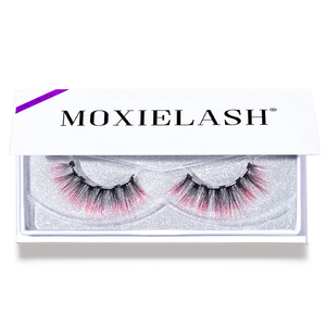 Pair of dramatic false eyelashes with pink accents displayed in a white Moxielash box, designed for bold eye looks, featuring Sunny Lash - Colored | Moxielash style.