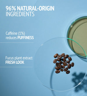 Close-up of coffee beans and a petri dish on a blue background highlighting 96% natural-origin ingredients with caffeine and fucus plant extract details for Sublime Skin Eye Patch | [ comfort zone ].