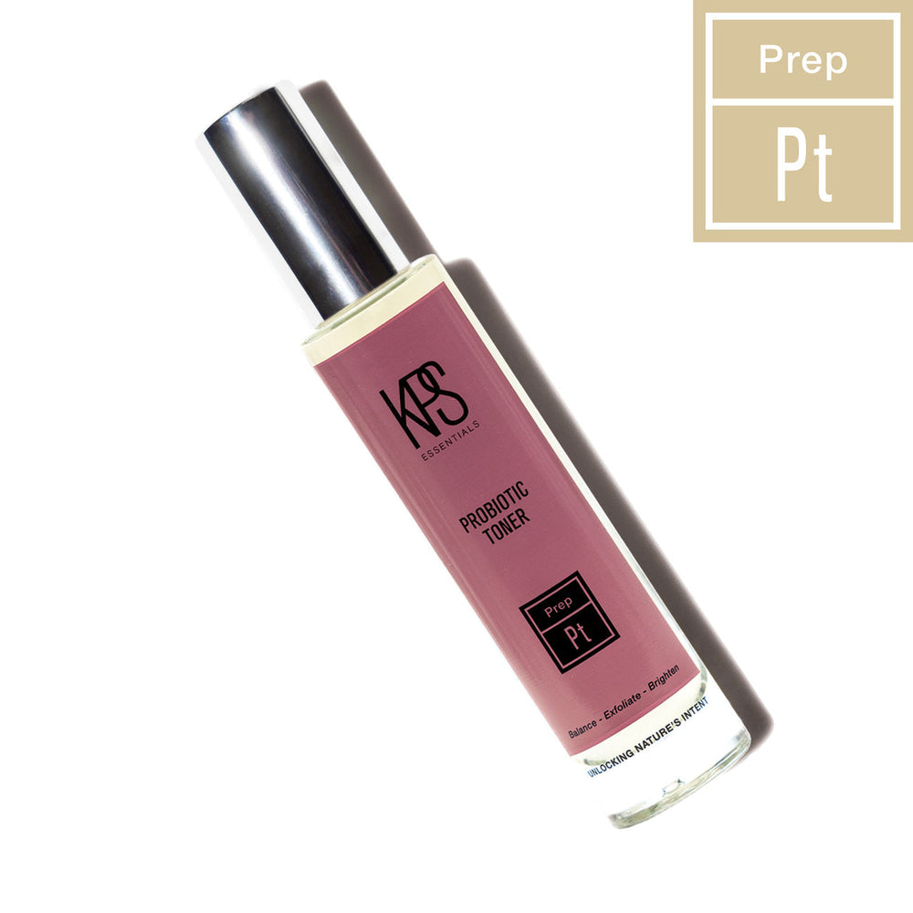Probiotic Toner | Kindness Powered Skincare in a sleek glass bottle with a metallic cap, shown with a warm shadow and minimalist prep label design for a clean skincare routine.