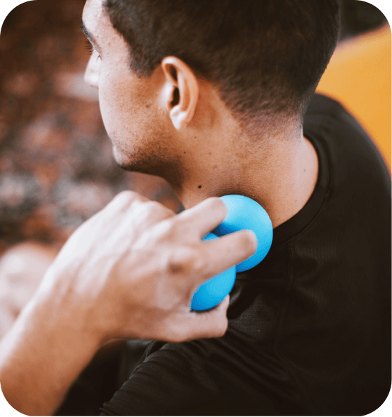 A person using the RAD Roller Original | RAD, a blue recovery tool, to massage the neck and promote muscle relaxation and wellness.