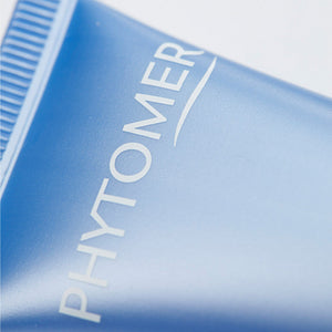 Close-up of the blue tube of Souffle Marin Cleansing Foaming Cream | Phytomer, a skincare product designed for gentle cleansing and refreshing the skin.